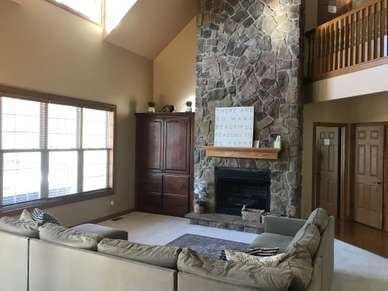 An addiction recovery center with stone walls and a fireplace.