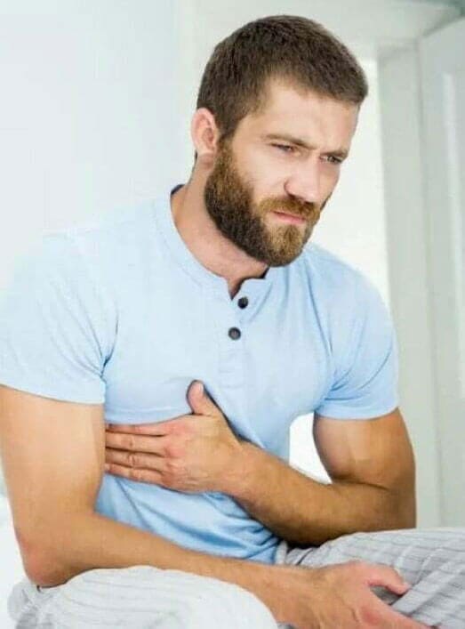 Man grabbing chest