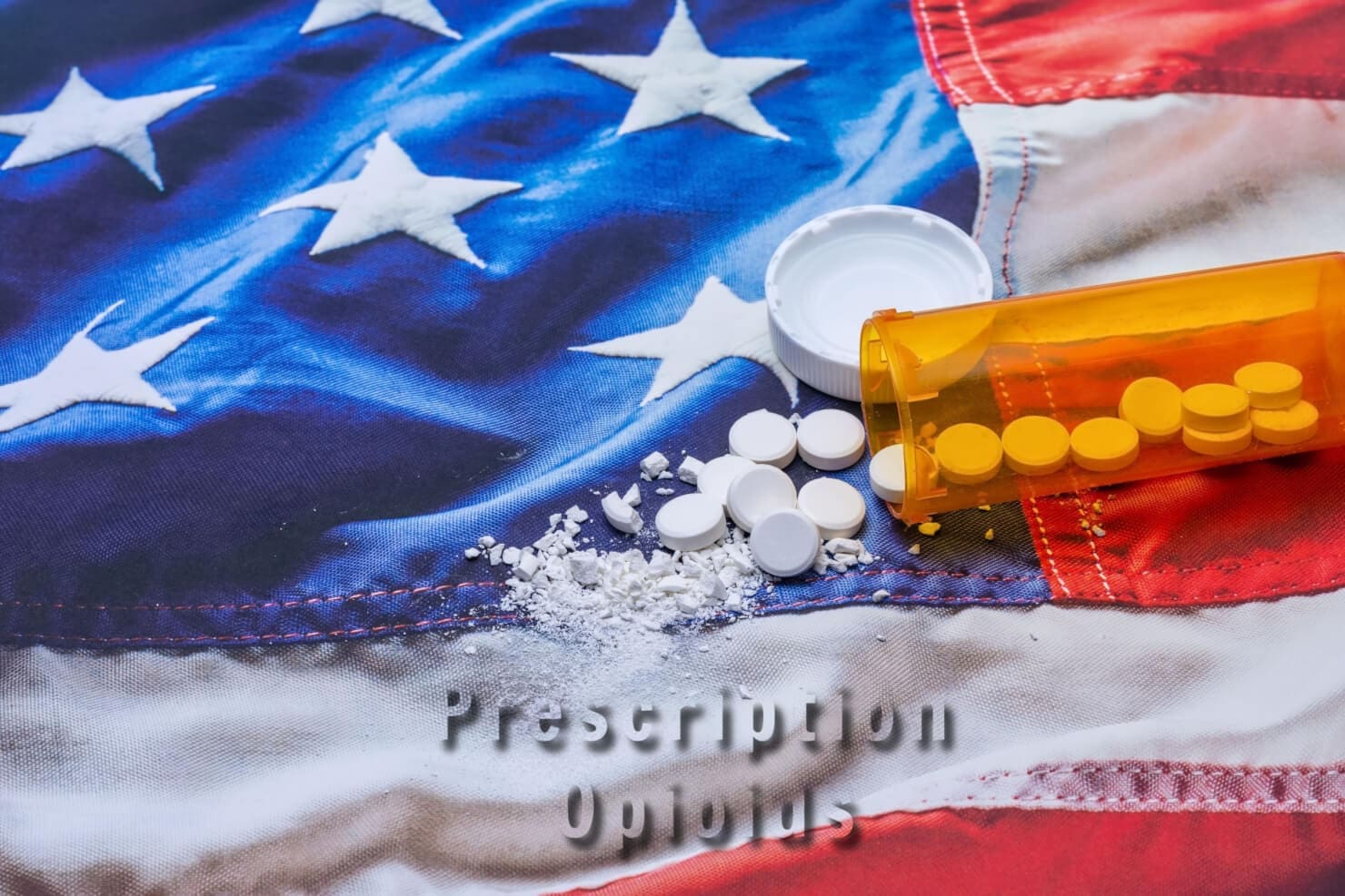 A patriotic American flag adorned with a pill bottle, symbolizing the struggle of addiction and the need for professional assistance in rehab or an addiction recovery center.
