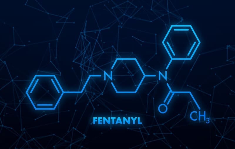The fentanyl molecule on a dark background in a men's only rehab facility.